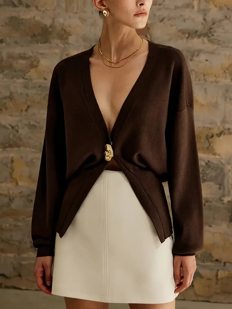 Top de manga larga con un botón y cintura ajustada