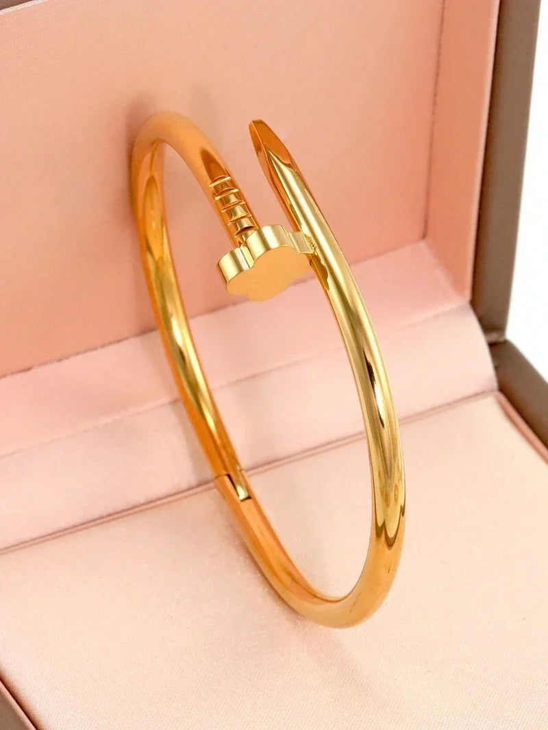 Gleaming Gold Tone Stainless Steel Four Leaf Clover Bangle