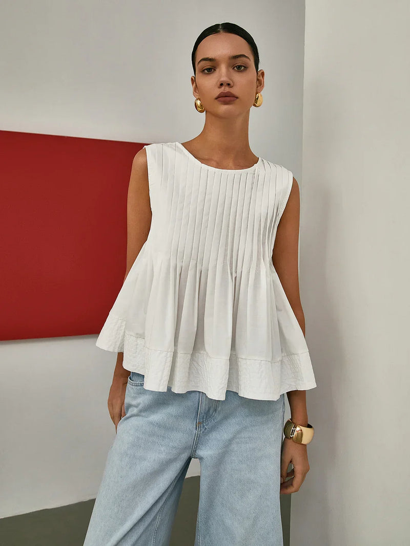 Blusa plisada sin mangas con peplum