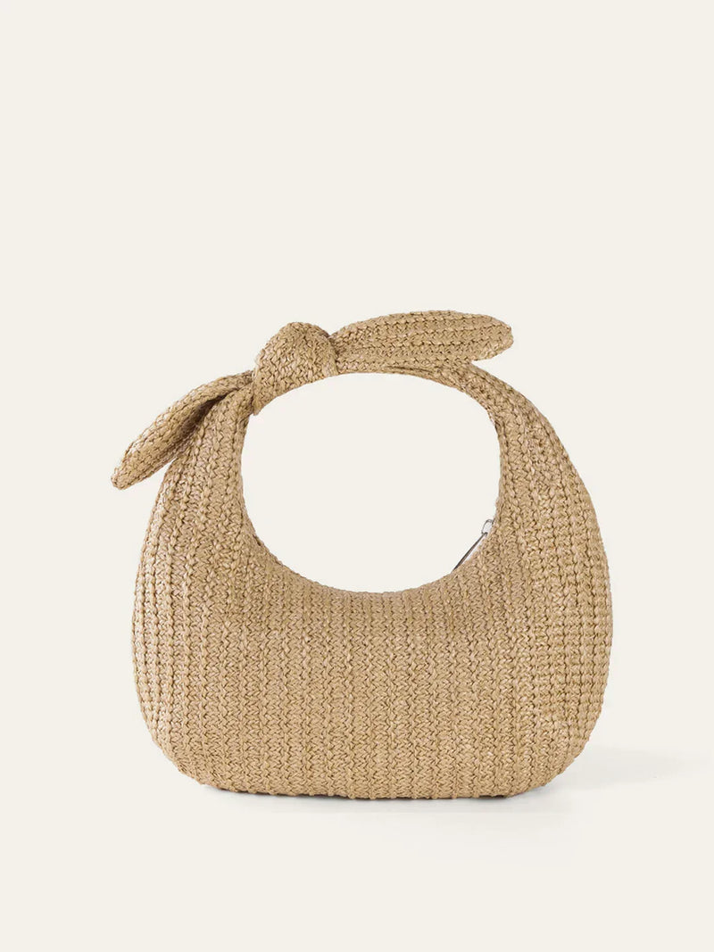 Bolso de paja con detalle de lazo estilo vacaciones