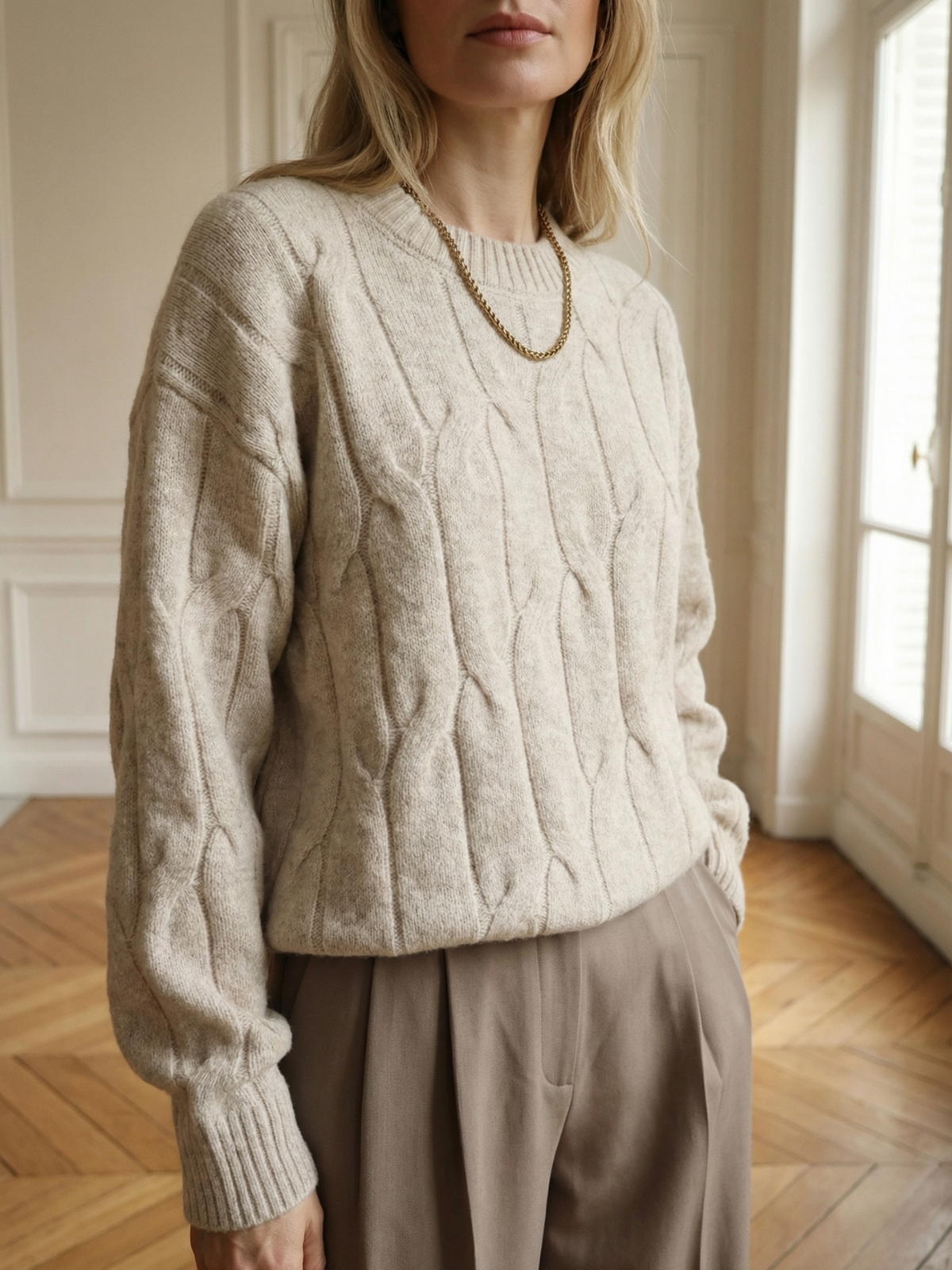 Suéter acogedor de punto trenzado