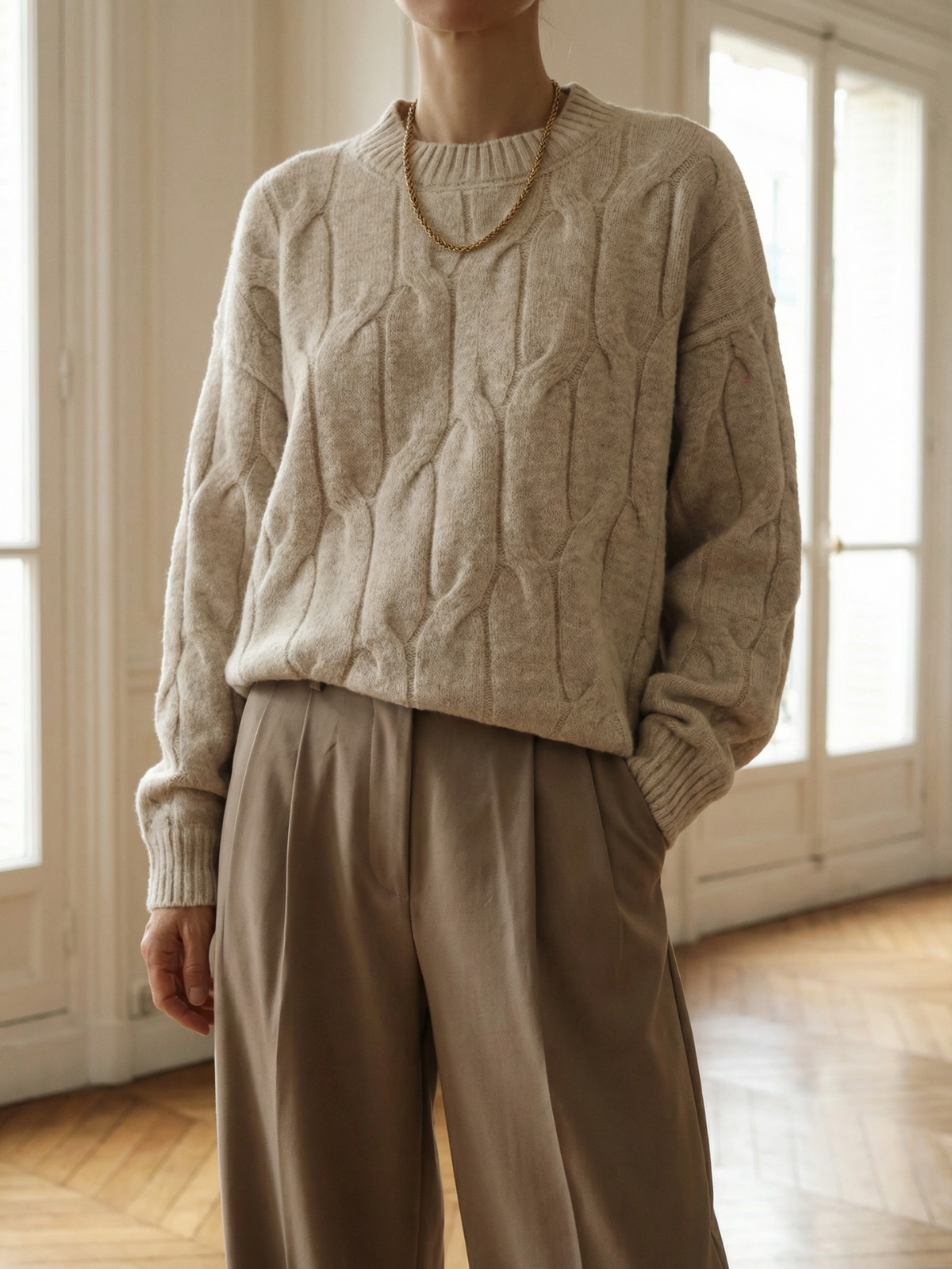 Suéter acogedor de punto trenzado